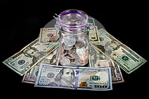 Coins in a Mason Jar on a Bed Currency