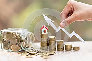 Coins money setting growth up increase to house model for concept investment mortgage finance and home loan business, business,