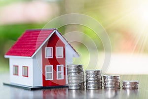 Coins money setting growth up increase to house model for concept investment mortgage finance and home loan business, business,