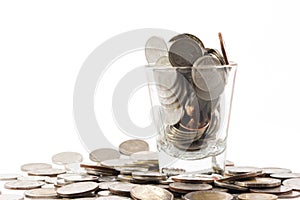 Coins over the glass be comparable to greed of human photo