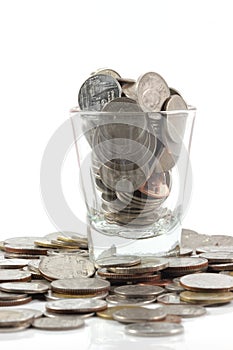 Coins over the glass be comparable to greed of human photo