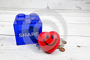 Coins in share savings jar, coins, smiling face expression, Charity and giving money to people is such a kind thing. Donate Give