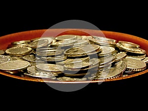 Coins in soup plate