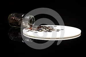 Coins Spilling From A Quart Mason Jar