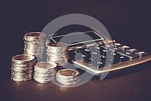 Coins Stack and calculator. Concept of money saving, financial. Savings money and income Investment ideas and financial management