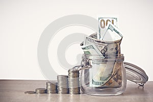 Coins Stack and US dollar bills in the glass jar. Concept of money saving, financial. Savings money and income Investment ideas