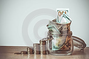 Coins Stack and US dollar bills in the glass jar. Concept of money saving, financial. Savings money and income Investment ideas
