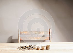 Coins stacked on an abstract vintage table. Savings ideas for economic investment, stable growth, and saving for retirement