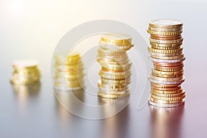 Money concept: Coins tacked on each other. Inflation, currency, savings, money photo