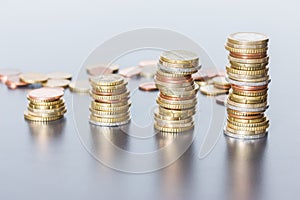 Money concept: Coins tacked on each other. Inflation, currency, savings, money photo
