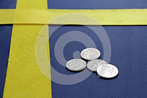 Coins of Sweden on the blue PVC leather with yellow fabric, put like a Sweden nation flag.