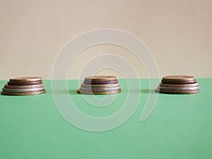 Coins with in three rows green background