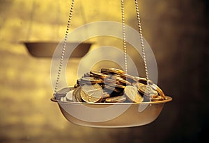 Coins on weighing machine photo