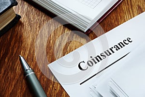 Coinsurance concept. Stack of insurance documents