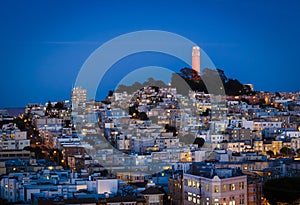 Coit tower and houses on the hill san francisco at night