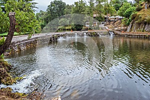Coja river beach with stone weir and small waterfalls of the river Alva, Arganil PORTUGAL photo