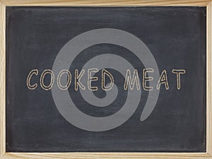 Coked meat written in yellow on a blackboard