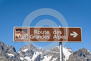 A sign showing the direction of the road of Alps