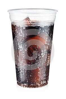 Cola carbonated drink with ice in a plastic cup isolated on white background