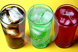 Cola, creme soda and raspberry soda fizzy drinks photo