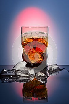 Cola in drinking glass with ice sweet sparkling carbonated drink beverage fast food with big calorie