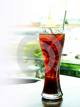 Cola in glass with cool ice for stop hungery eagerly