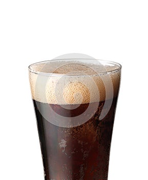 Cola glass with ice cubes and bubbles. Cold sweet drink on white background