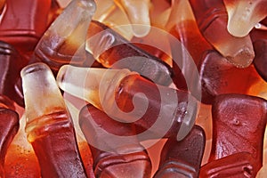 Cola gum candy. Gummy candy cola flavored sweet snack. Cola bottle shaped sweets. photo