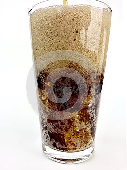 Cola with ice in a clear glass