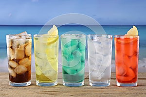Cola and lemonade soda drinks on the beach