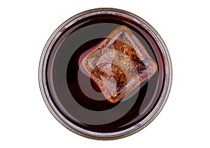 Cola soda drink with ice cube top view