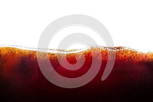 Cola soda with sparkling bubbles isolated on white