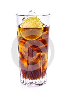 Cola in tall glass with ice cubes and lime
