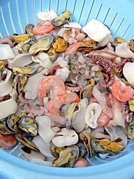 Colander with fresh seafood