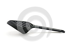 Colander ladle on white background