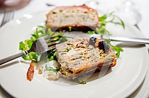 Cold appetizer with chicken terrine and cherry sauce
