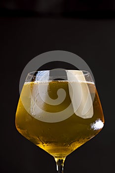 cold apple juice drink in a clear glass