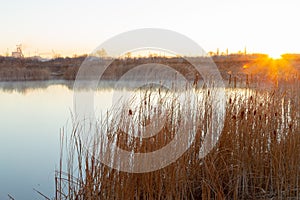 Cold autumn morning and sunrise over the lake