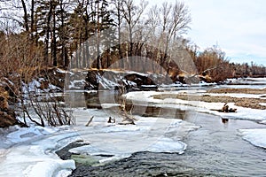 Cold autumn or spring  siberian landscape frozen river shore covered with snow and ice