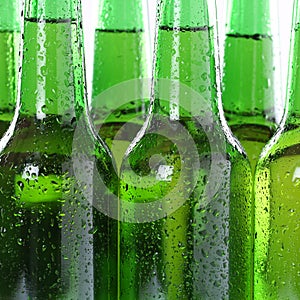 Cold beer drinks in bottles with water drops