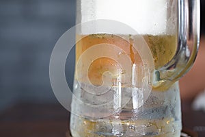 Cold beer in a glass with water drops