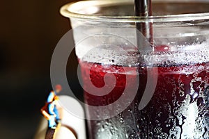 Cold beverage plastic cup scene.