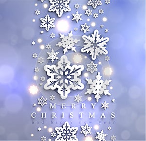 Cold blue sparkling Christmas background with snowflakes