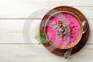 Cold borscht or Holodnik, traditional summer beet soup in ceramic bowl on wooden background