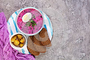 Cold borscht on wooden background. Cold beet soup. Top view