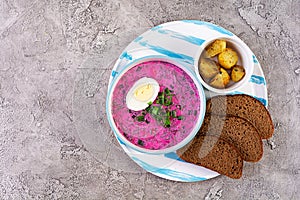 Cold borscht on wooden background. Cold beet soup. Top view