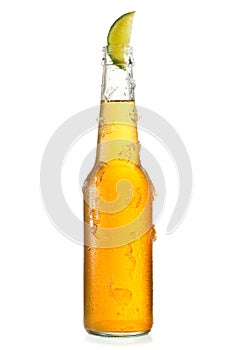 Cold bottle of beer with lime