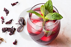 Cold Brew Hibiscus Tea with ice and Mint Leaves.