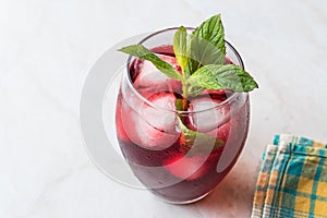 Cold Brew Hibiscus Tea with ice and Mint Leaves.