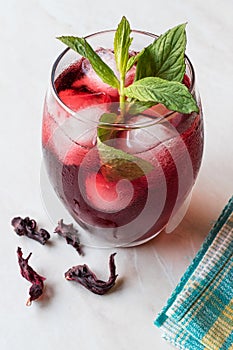 Cold Brew Hibiscus Tea with ice and Mint Leaves.